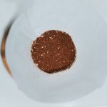 brown powder on white ceramic bowl